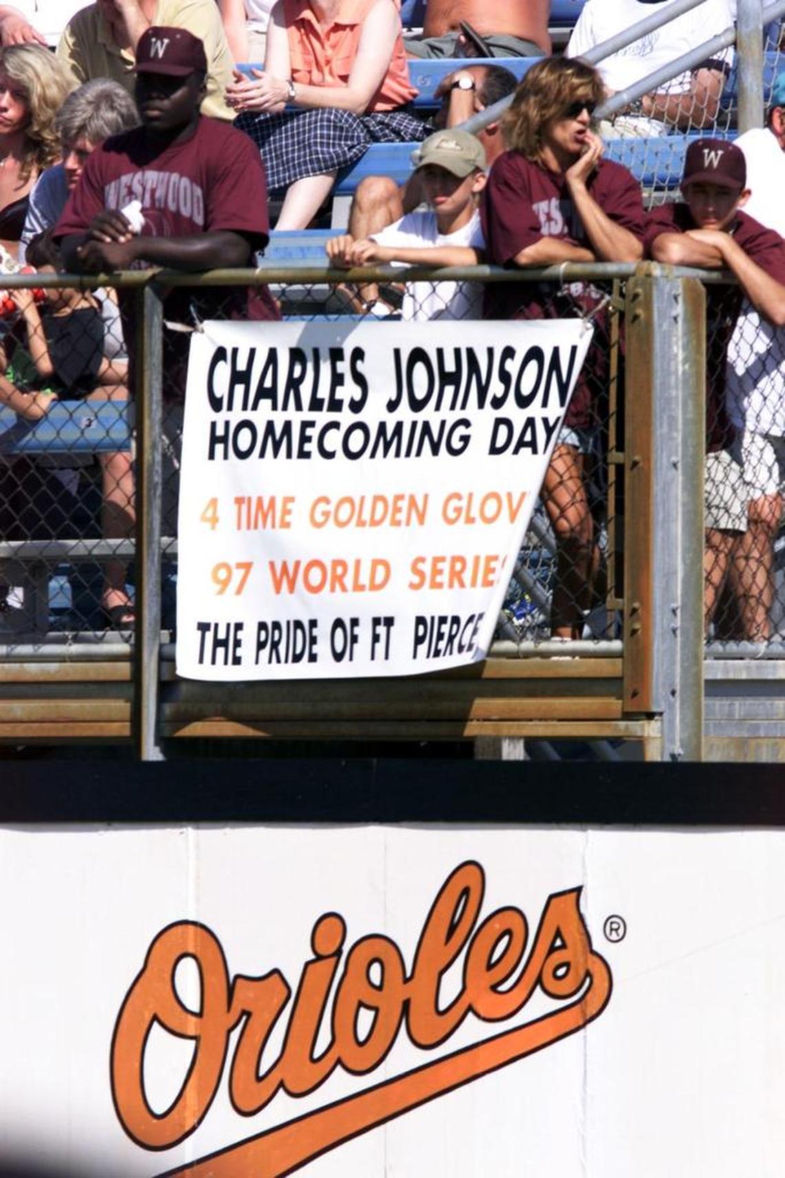Fans from Fort Pierce salute Baltimore catcher Charles Johnson during an Orioles spring training game in Fort Lauderdale on March 7, 1999.