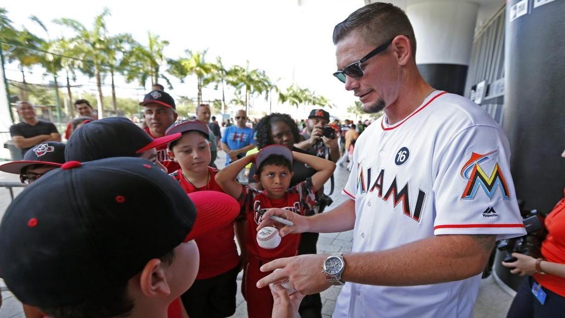 The Marlins’ Nick Wittgren signs baseballs for young fans during Marlins FanFest on Saturday at Marlins Park, which was going on amid reports that the team is about to be sold.