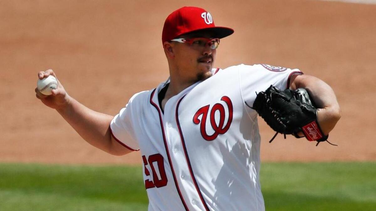 Pitcher Vance Worley, seen here pitching for the Washington Nationals on March 20 in West Palm Beach, signed a minor-league deal with the Marlins on Sunday. (AP Photo/John Bazemore)