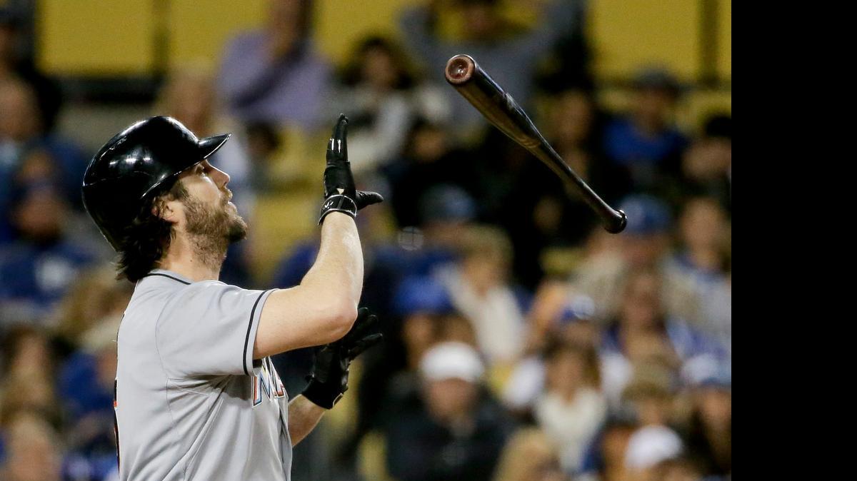 
Miami Marlins' Dan Haren tosses his bat after striking out against the Los Angeles Dodgers during fifth inning in Los Angeles, Tuesday, May 12, 2015.
