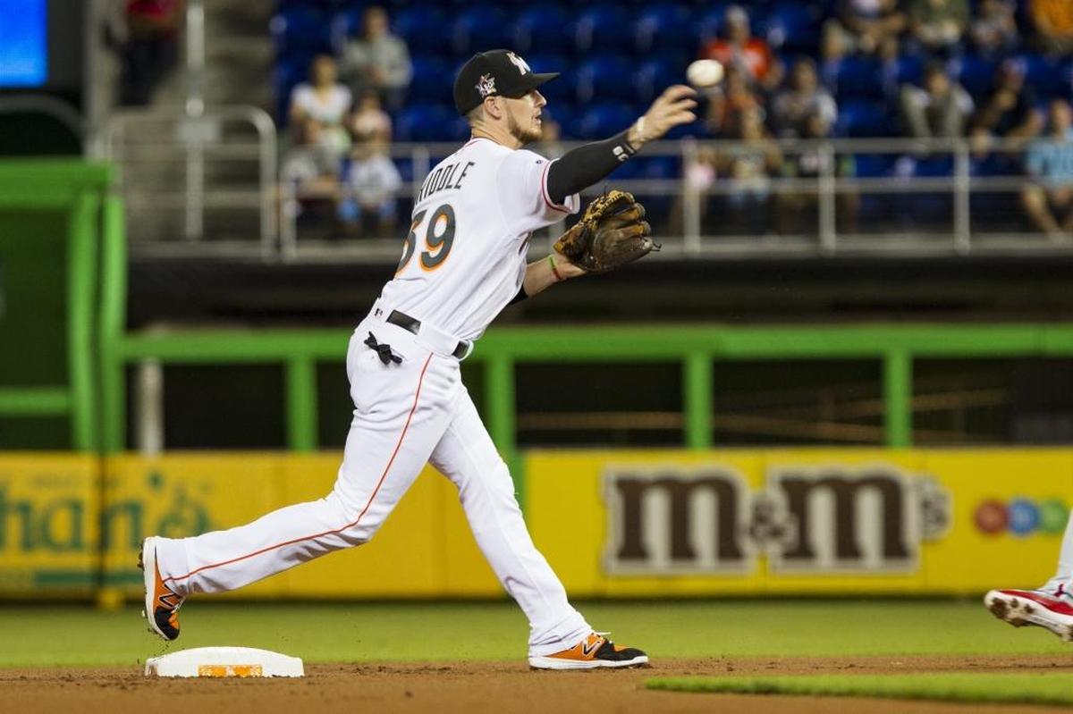 Marlins short stop JT Riddle turns a double play as the Miami Marlins play the Philadelphia Phillies at Marlins Park on Mon., July 17, 2017.