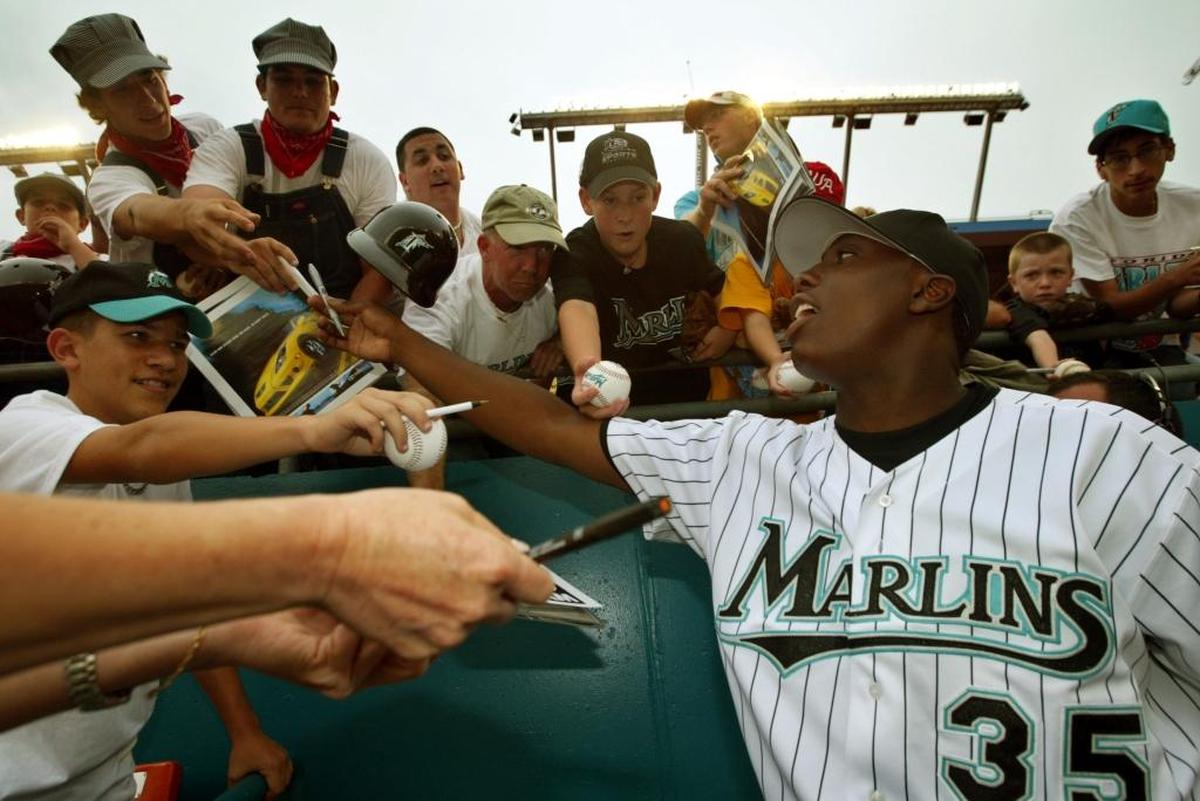 Dontrelle Willis signs autographs before a Marlins game at Pro Player Stadium in 2003.