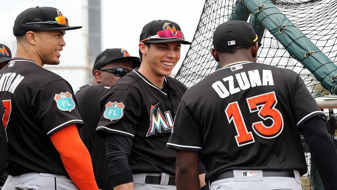Marlins left fielder Christian Yelich, center, is slated to hit third in the lineup, behind center fielder Marcell Ozuna and in front of right fielder Giancarlo Stanton, left. Yelich hit .298 in the No. 3 spot in 43 games last year and had three homers and 15 RBI.