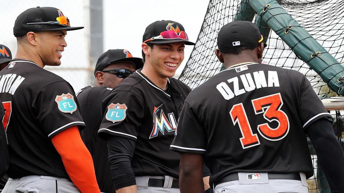 Marlins left fielder Christian Yelich, center, is slated to hit third in the lineup, behind center fielder Marcell Ozuna and in front of right fielder Giancarlo Stanton, left. Yelich hit .298 in the No. 3 spot in 43 games last year and had three homers and 15 RBI.