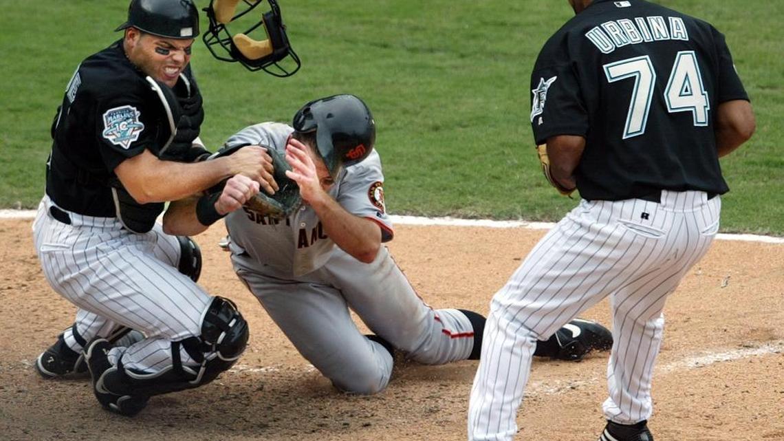 Ivan Rodriguez of the Marlins applies the tag on J.T. Snow of the Giants for the final out of the 2003 National League Division Series.