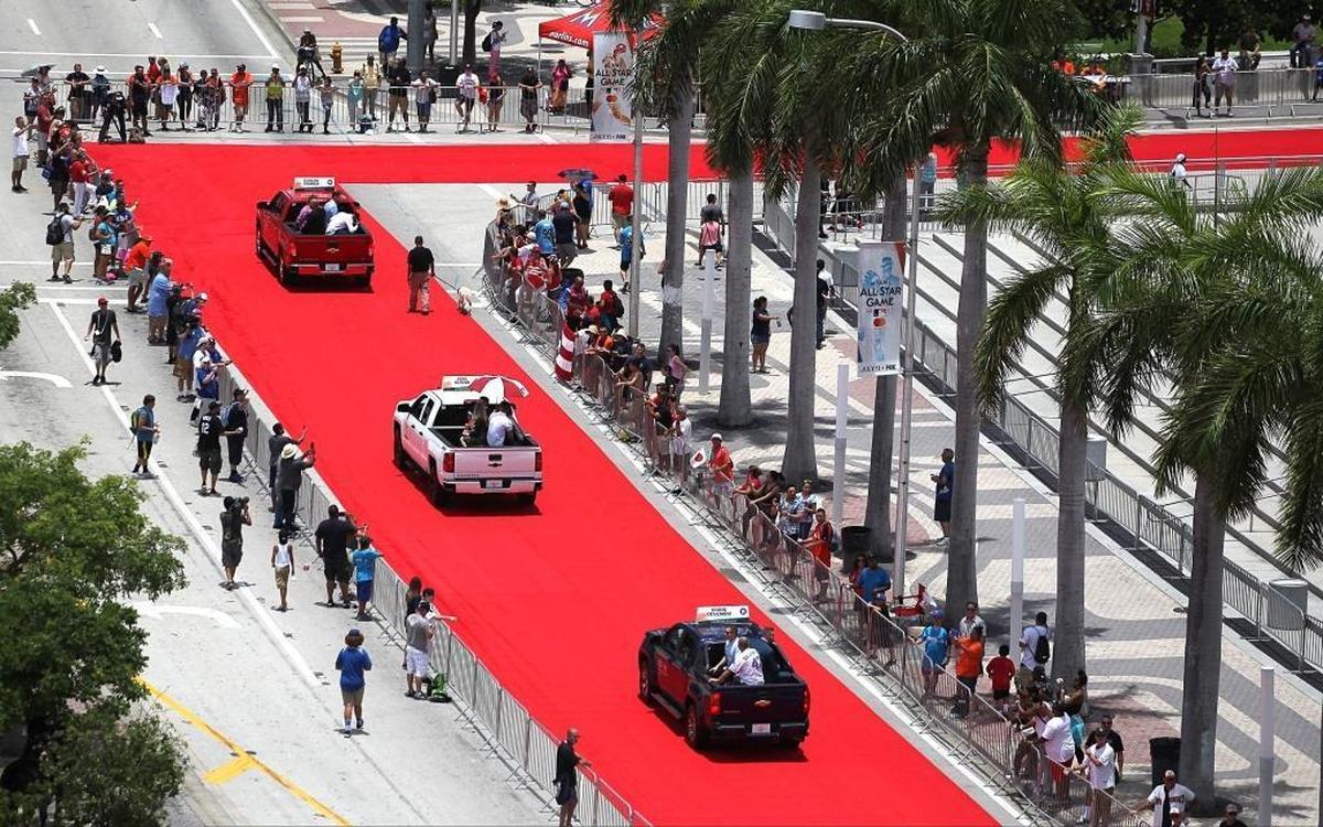Pick-up trucks with MLB players Carlos Correa, top, Jose Altuve, and Chris Devenski, bottom, make their way to the American Airlines Arena on the red carpet as fans lined-up the parade route during the MLB's "All Star Red Carpet Show 2017" parade on Tues., July 11, 2017.