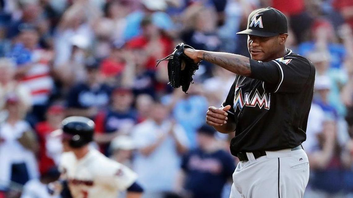 Miami Marlins relief pitcher Edwin Jackson stands on the mound after giving up a three-run home run to Atlanta Braves' Gordon Beckham, rear, in the seventh inning of a baseball game on May 28, 2016 in Atlanta.