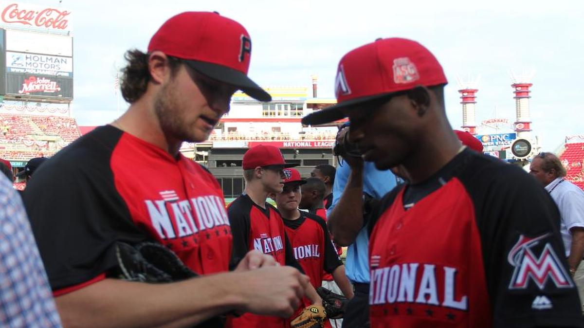 
Miami second baseman Dee Gordon, right, chats with Pirates right-hander Gerrit Cole before the Home Run Derby on Monday.

