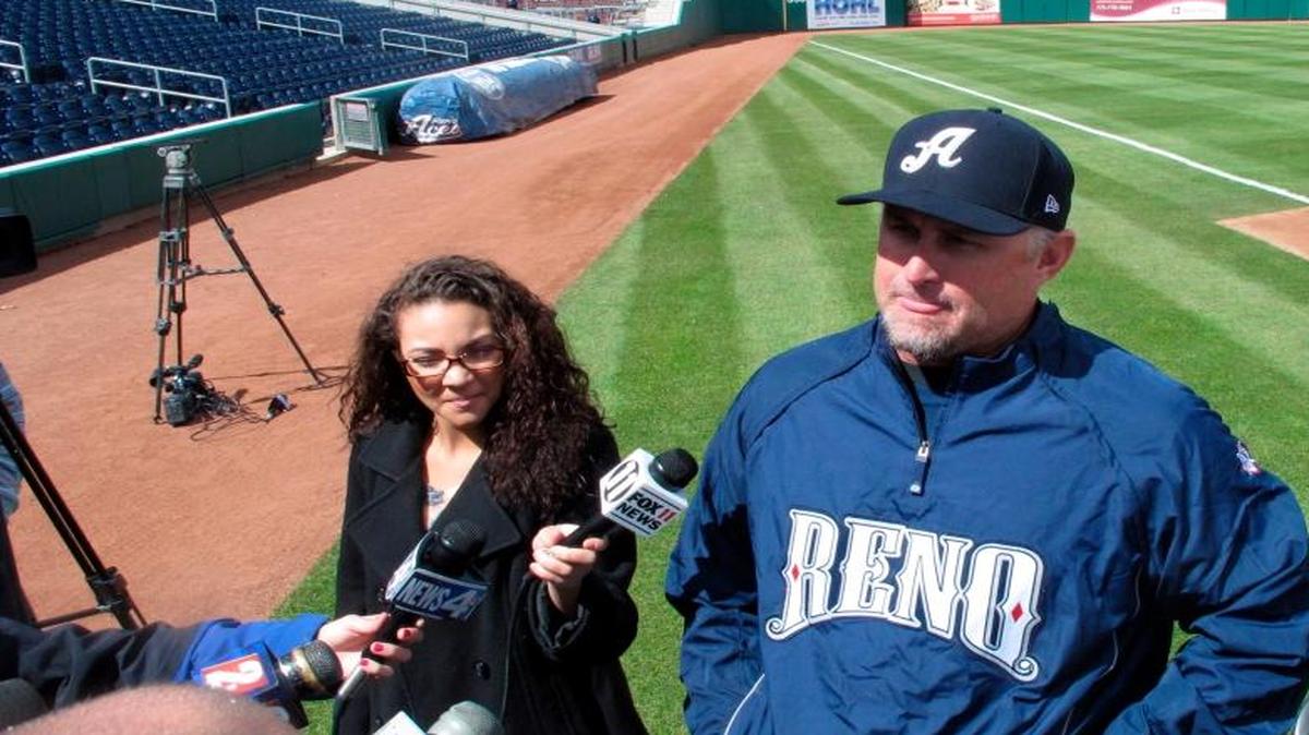 
In this photo taken on Tuesday, April 1, 2014, snow flurries fall as Reno Aces manager Phil Nevin talks to reporters at the Triple-A baseball team's media day at Aces Ballpark in Reno, Nev. 
