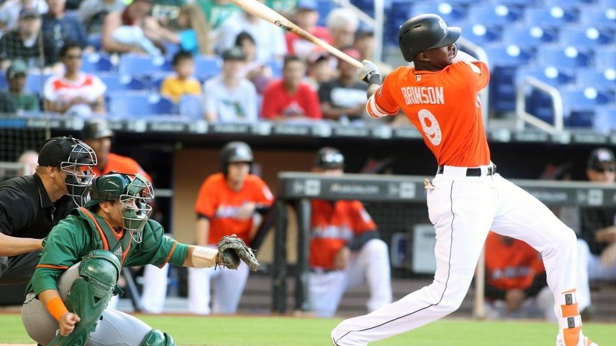 Miami Marlins outfielder Lewis Brinson hits a home run during the first inning of a exhibition baseball game against the University of Miami Hurricanes at Marlins Park on Tues., March 27, 2018 in Miami.