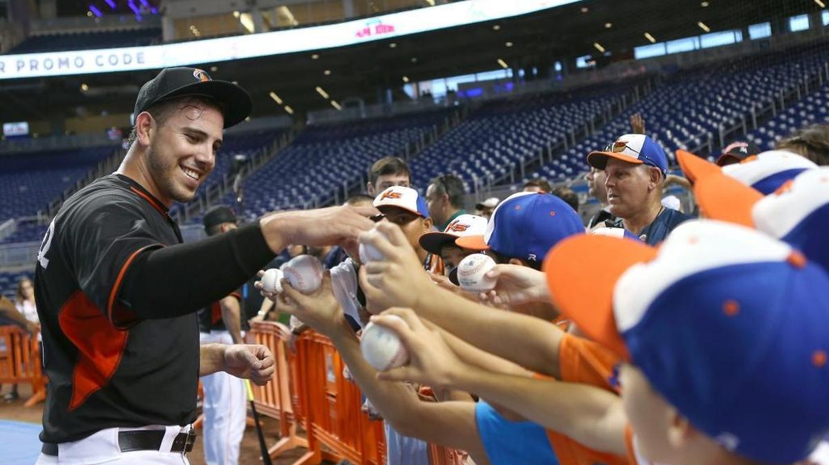 Miami Marlins pitcher Jose Fernandez signing autographs to fans before the start of the game against the Washington Nationals on May 20, 2016 at Marlins Park in Miami.