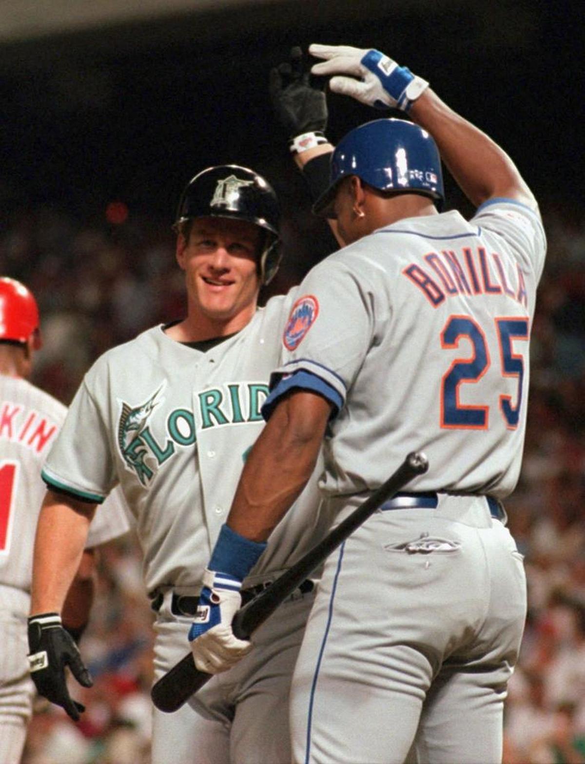 Florida’s Jeff Conine is greeted by New York’s Bobby Bonilla after his go-ahead homer in the eighth inning of the 1995 All-Star Game at The Ballpark in Arlington.