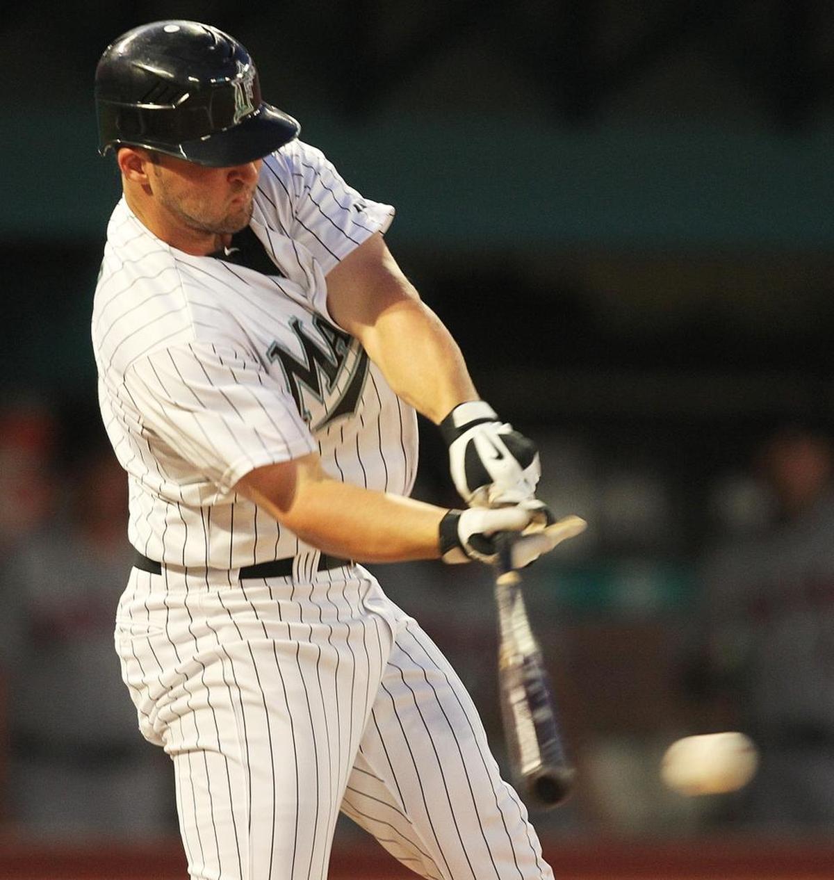 Florida’s Dan Uggla singles against the Mets during the 2010 season at Sun Life Stadium in Mami Gardens.