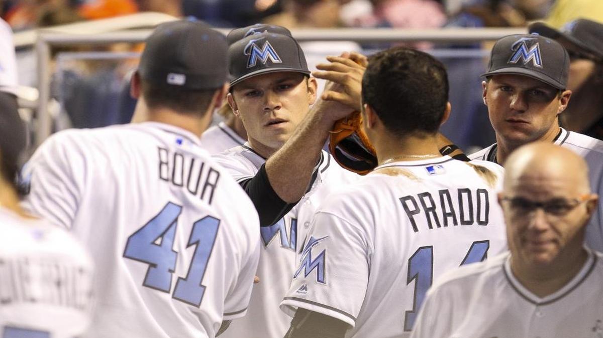 Miami Marlins' pitcher David Phelps (35) celebrates with his teammates after striking out Colorado Rockies' Carlos Gonzalez (5) in the eighth inning at Marlins Park in Little Havana on Sun., June 19, 2016.