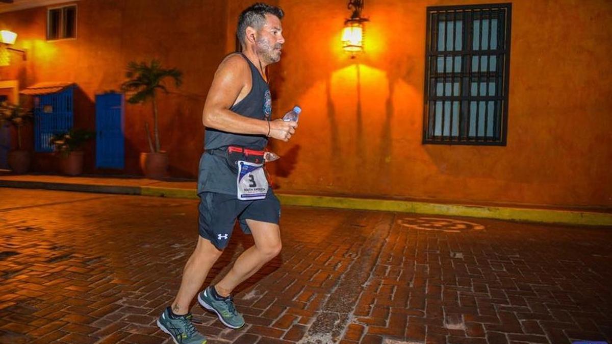 Former Miami Marlins president David Samson pounds along the streets of Cartagena, Colombia in his sixth of seven marathons in seven days.