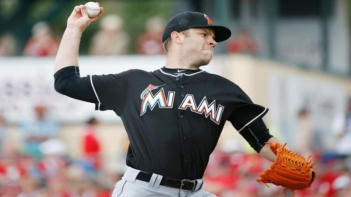 Miami Marlins starting pitcher David Phelps, delivers during the first inning of an exhibition spring training baseball game against the St. Louis Cardinals, Sunday, March 20, 2016, in Jupiter, Fla.