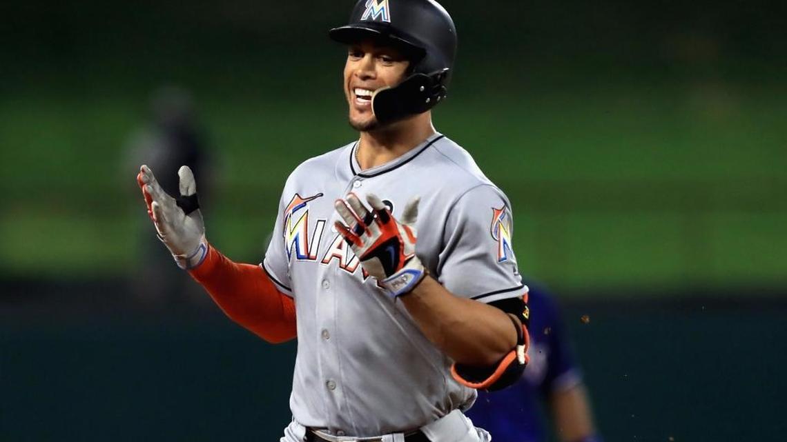 Miami Marlins’ Giancarlo Stanton runs the bases after hitting a home run against the Texas Rangers in the eighth inning at Globe Life Park in Arlington on July 24, 2017, in Arlington, Texas.