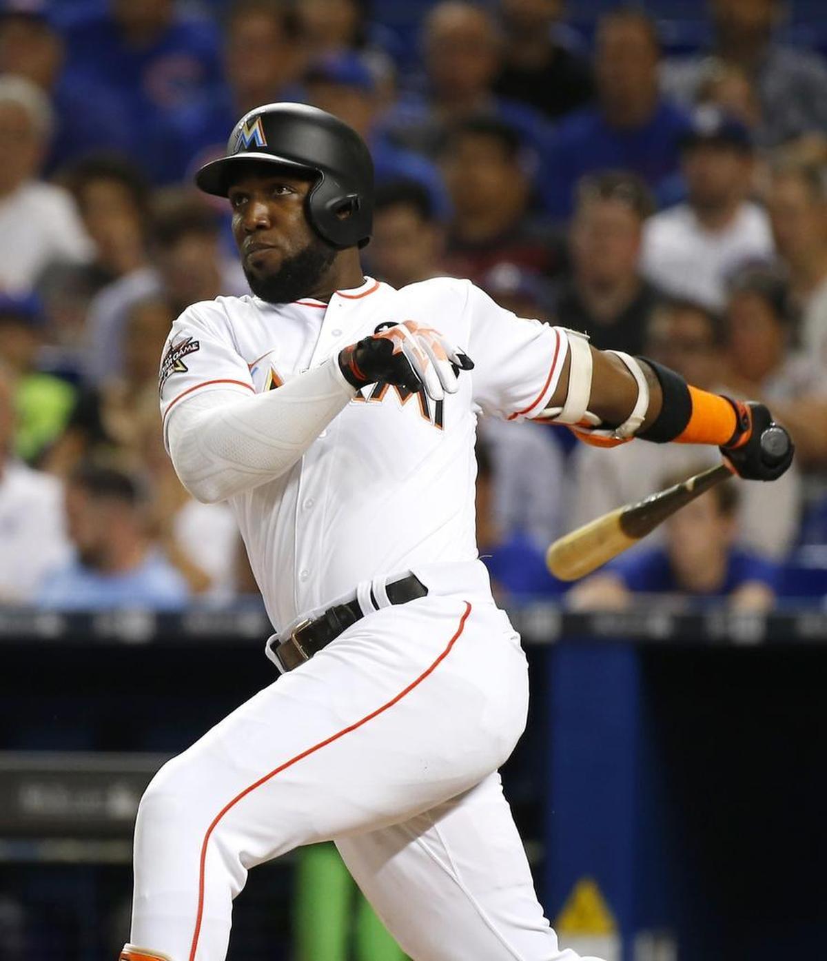 Miami left fielder Marcell Ozuna hits a solo home run during the second inning of a baseball game against the Chicago Cubs at Marlins Park on June 22, 2017.