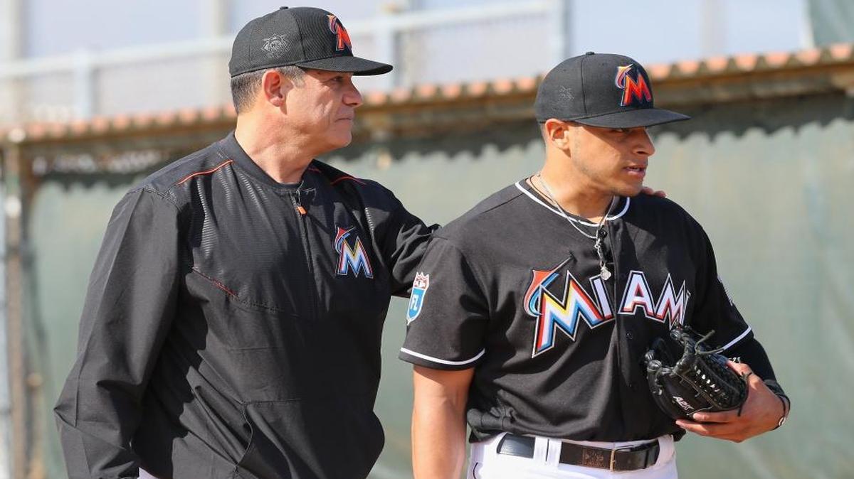 Miami Marlins pitching coach Juan Nieves, left, talks with pitcher A.J. Ramos as pitchers and catchers report for spring training at Roger Dean Stadium on Friday, February 19, 2016 in Jupiter, Florida.