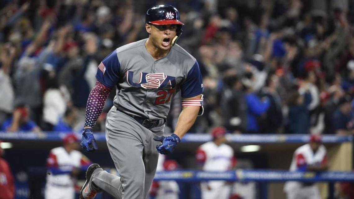 Giancarlo Stanton celebrates a home run in San Diego while helping the U.S. team in its World Baseball Classic title run.