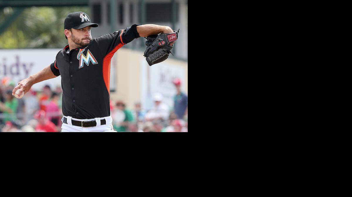 
Miami Marlins pitcher Jarred Cosart throws in the first inning against the St. Louis Cardinals in a spring training game at Roger Dean Stadium in Jupiter on Tuesday, March 17, 2015.
