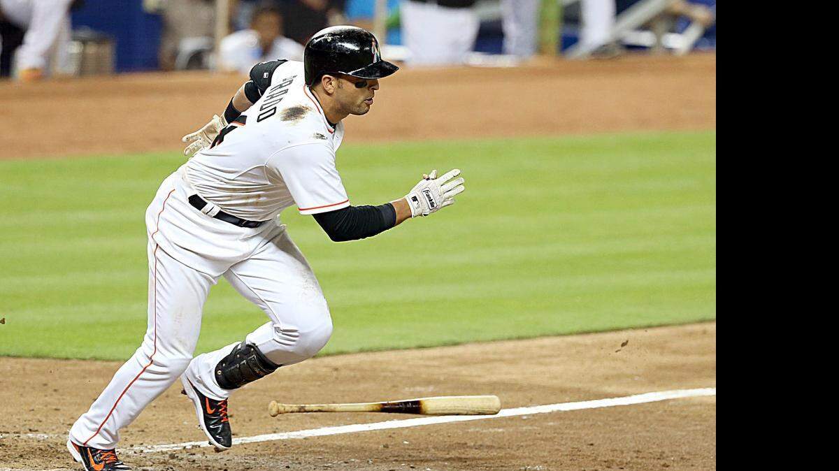 
Martin Prado heads to first base after hitting an RBI single that drove in Adeiny Hechavarria in the eighth inning against the Washington Nationals at Marlins Park on Friday, April 24, 2015. The Marlins won 3-2.
