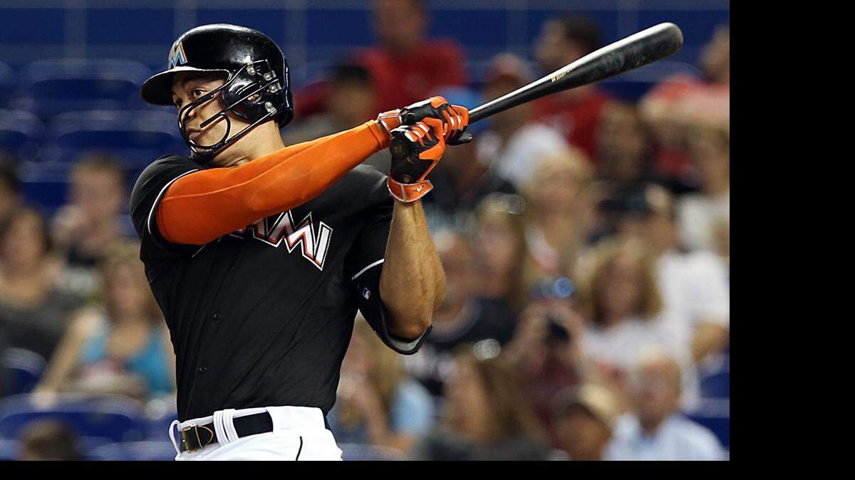 
Miami Marlins Giancarlo Stanton doubles in the fourth inning against the Washington Nationals at Marlins Park on Saturday, April 25, 2015.
