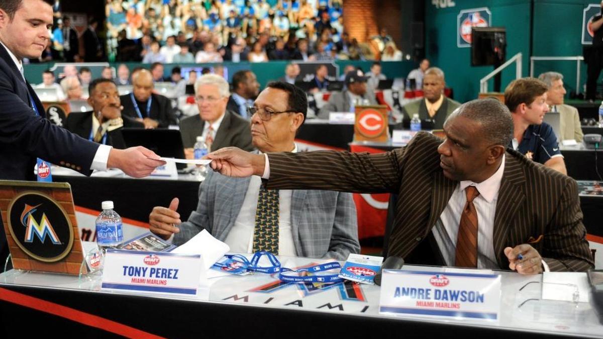 
Miami Marlins representatives Tony Perez, left, and Andre Dawson hand over their pick during the 2014 MLB baseball draft Thursday, June 5, 2014, in Secaucus, N.J. The Marlins chose Tyler Kolek with the second pick in the draft. 
