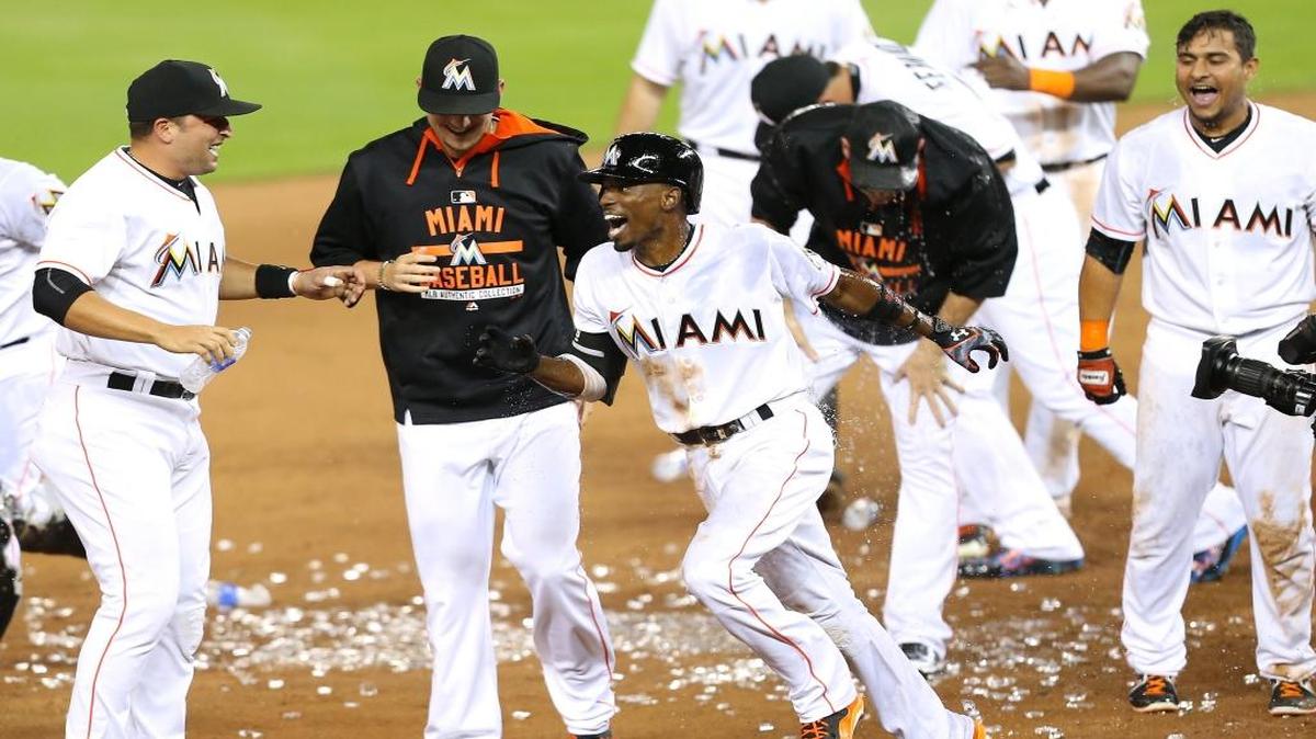 
Dee Gordon of the Miami Marlins celebrates with teammates after hitting a walk-off double to defeat the Philadelphia Phillies 4-3 in the eleventh inning inning of a baseball game on Wednesday, September 23, 2015, at Marlins Park in Miami.
