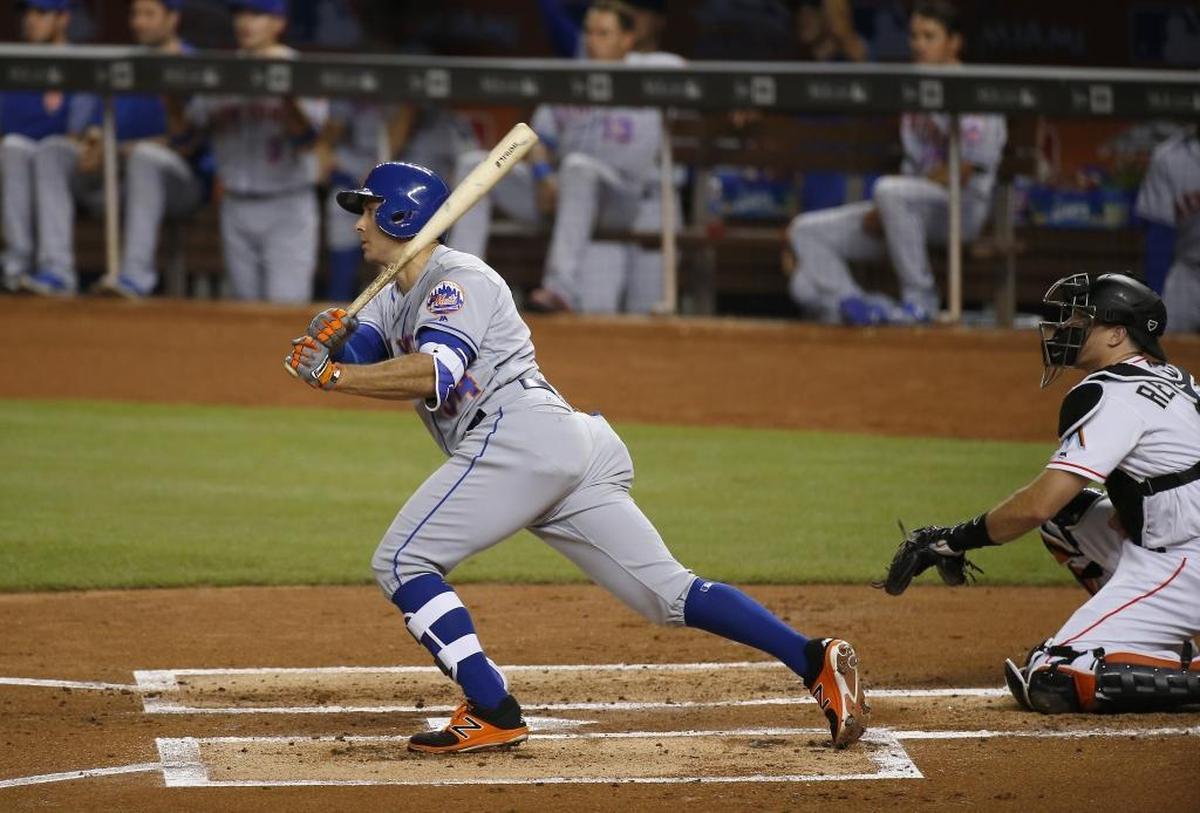 New York Mets first baseman T.J. Rivera hits a RBI double during the first inning of a baseball game against the Miami Marlins at Marlins Park on Thurs., June 29, 2017 in Miami.