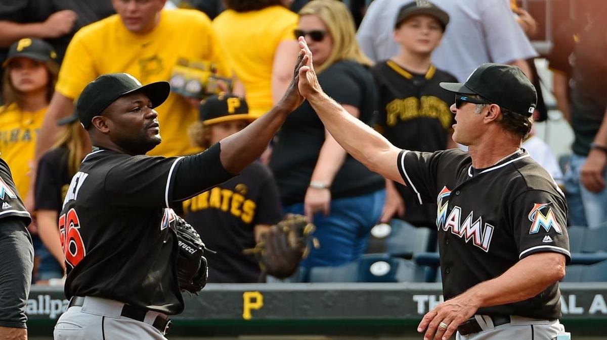 Fernando Rodney, left, high-fives manager Don Mattingly after the Marlins finished a sweep of the Pittsburgh Pirates on Sunday.