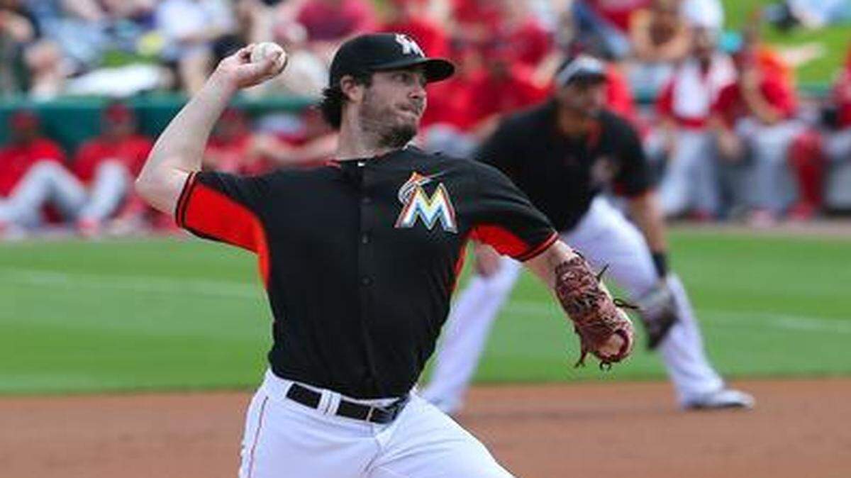 
Miami Marlins pitcher Dan Haren throws against the St. Louis Cardinals during the first inning of a spring training game at Roger Dean Stadium in Jupiter on Thursday, March 5, 2015.
