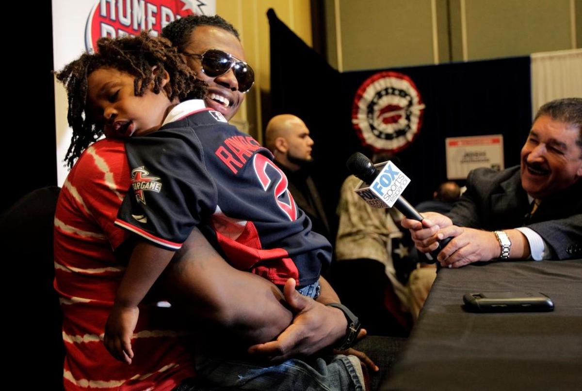 Hansel Ramirez, son of the Florida Marlins' Hanley Ramirez, takes a nap as Ramirez talks to reporters during a media availability for the 2010 All-Star Game in Anaheim.