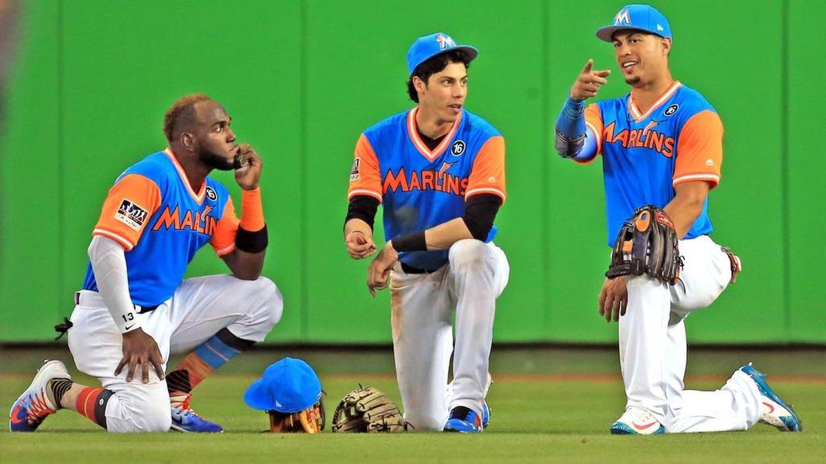 The Marlins completed an overhaul of their outfield on Thursday when they traded Christian Yelich (center) to the Milwaukee Brewers for four prospects.