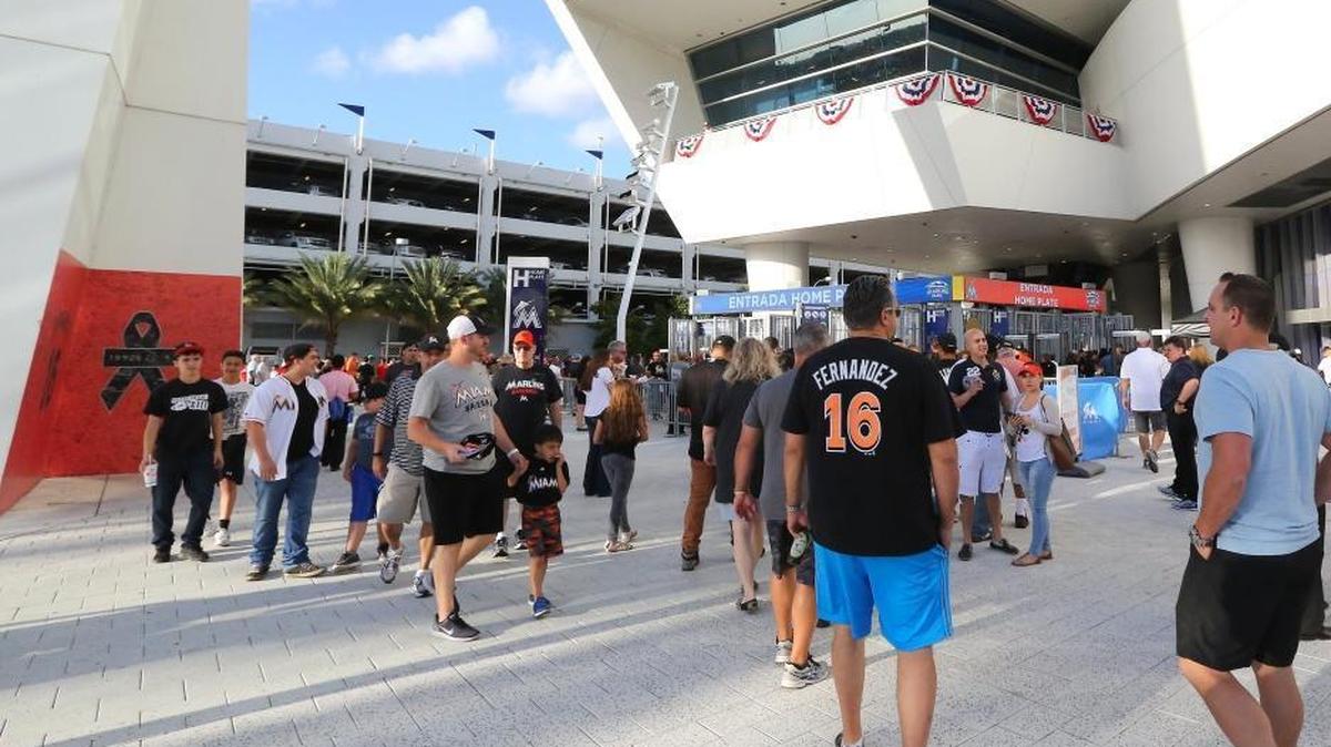 Fans line up outside before the start of the Miami Marlins’ home opener, against the Atlanta Braves, at Marlins Park on Tuesday, April 11, 2017 in in Miami.