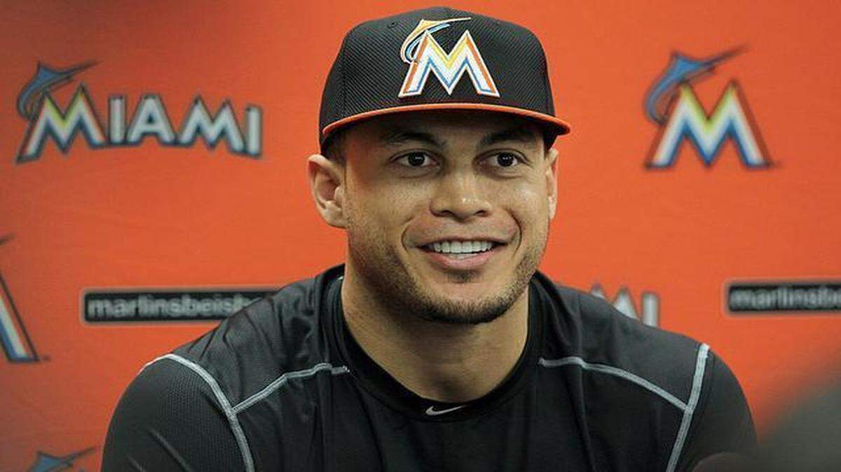 Miami Marlins outfielder Giancarlo Stanton laughs as he talk to reporters at a press conference during the spring training full-squad workouts and game at Roger Dean Stadium on Jupiter Tuesday, February 24, 2015.
