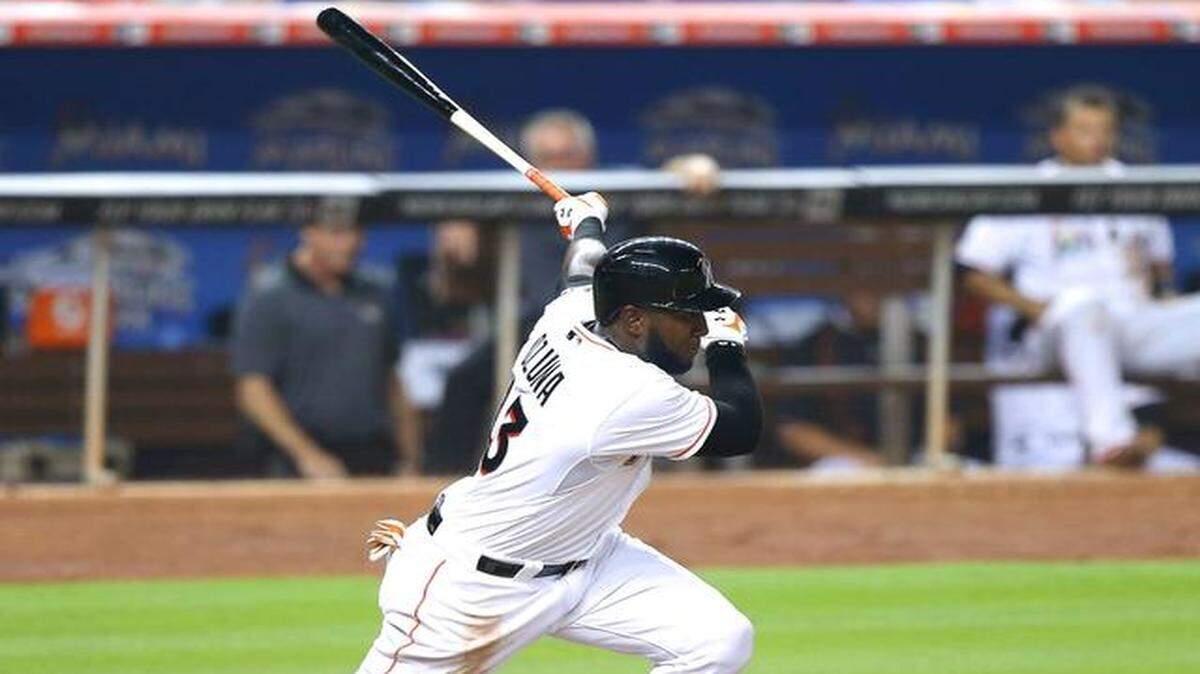 
Miami Marlins center fielder Marcell Ozuna connects for a single in the second inning against the Atlanta Braves during their baseball game at Marlins Park in Miami, Tuesday, April 7, 2015.
