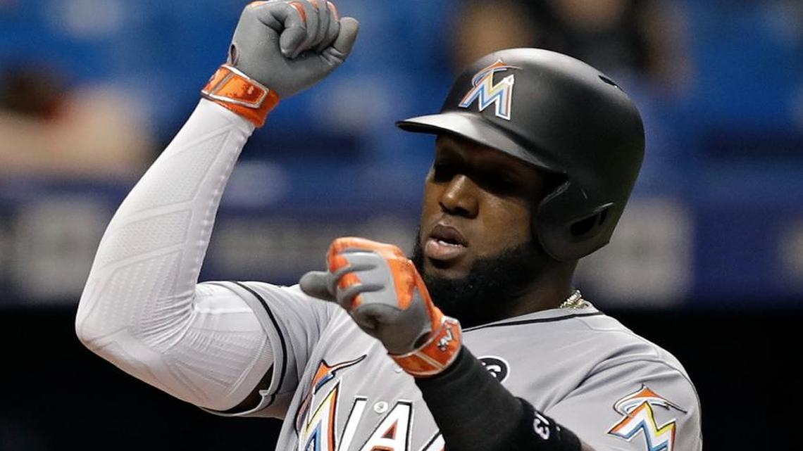 Miami Marlins' Marcell Ozuna celebrates after his home run off Tampa Bay Rays starting pitcher Blake Snell during the fourth inning of a baseball game, Wed., May 3, 2017, in St. Petersburg, Fla.