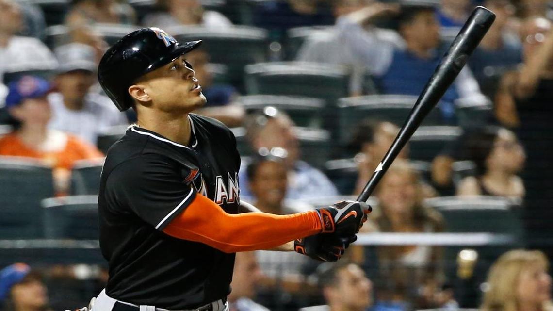 Miami Marlins Giancarlo Stanton watches his eighth-inning, three-run, home run in a baseball game against the New York Mets, Tues., July 5, 2016, in New York. It was Stanton's second home run of the game.