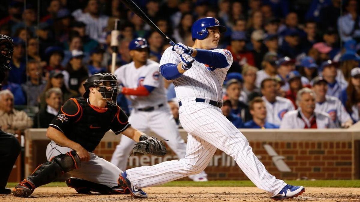 Chicago Cubs' Anthony Rizzo, right and Miami Marlins catcher J.T. Realmuto watch Rizzo's three-run home run, also scoring Kris Bryant and Jon Jay, during the fifth inning of a baseball game Tues., June 6, 2017, in Chicago.