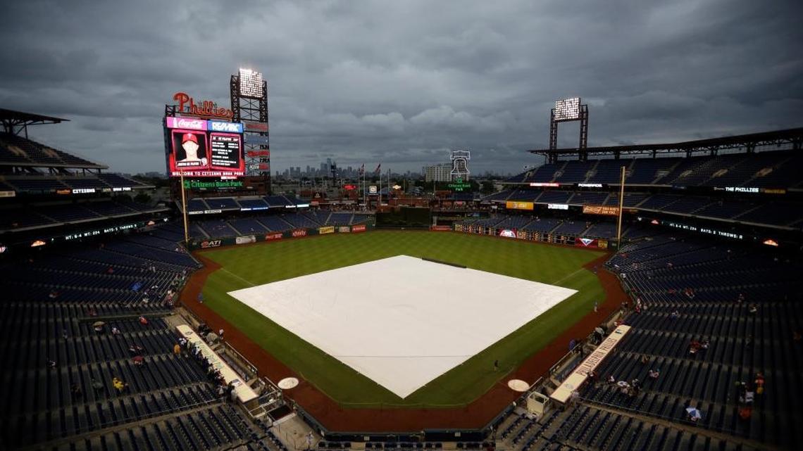 
A tarp covers the infield of Citizens Bank Park as rain delays the start of a game between Phillies and Chicago on Saturday, Sept. 12, 2015 in Philadelphia. 
