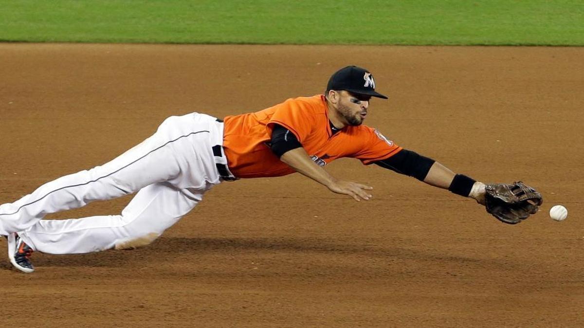 
Miami Marlins third baseman Martin Prado cannot get to a single hit by Washington Nationals' Tyler Moore in the fourth inning of a baseball game at Marlins Park in Miami on Sept. 13, 2015.
