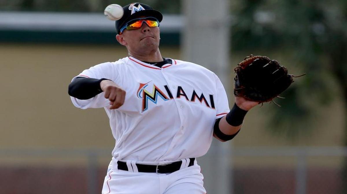 Miami Marlins infielder Miguel Rojas throws to first during spring training baseball practice Wednesday, Feb. 24, 2016, in Jupiter, Fla.