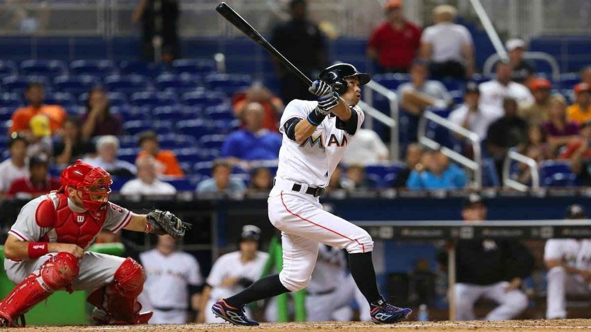 Marlins outfielder Ichiro Suzuki follows through on a two-run home run during the eighth inning of the game against the Philadelphia Phillies on Sept. 6, 2016, at Marlins Park in Miami. It was the first pinch-hit home run of his historic career.