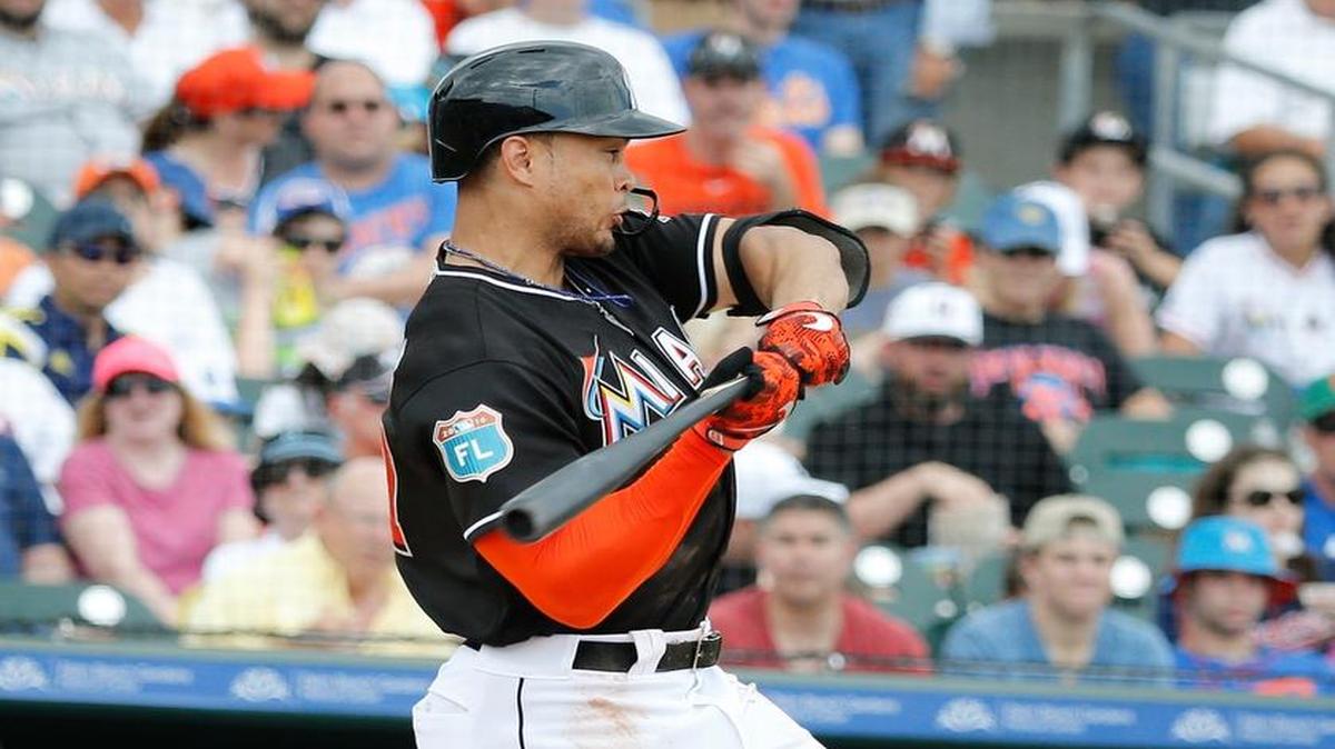Miami Marlins' Giancarlo Stanton lines up to swing during the second inning of an exhibition spring training baseball game against the New York Mets, Sunday, March 13, 2016, in Jupiter, Fla.