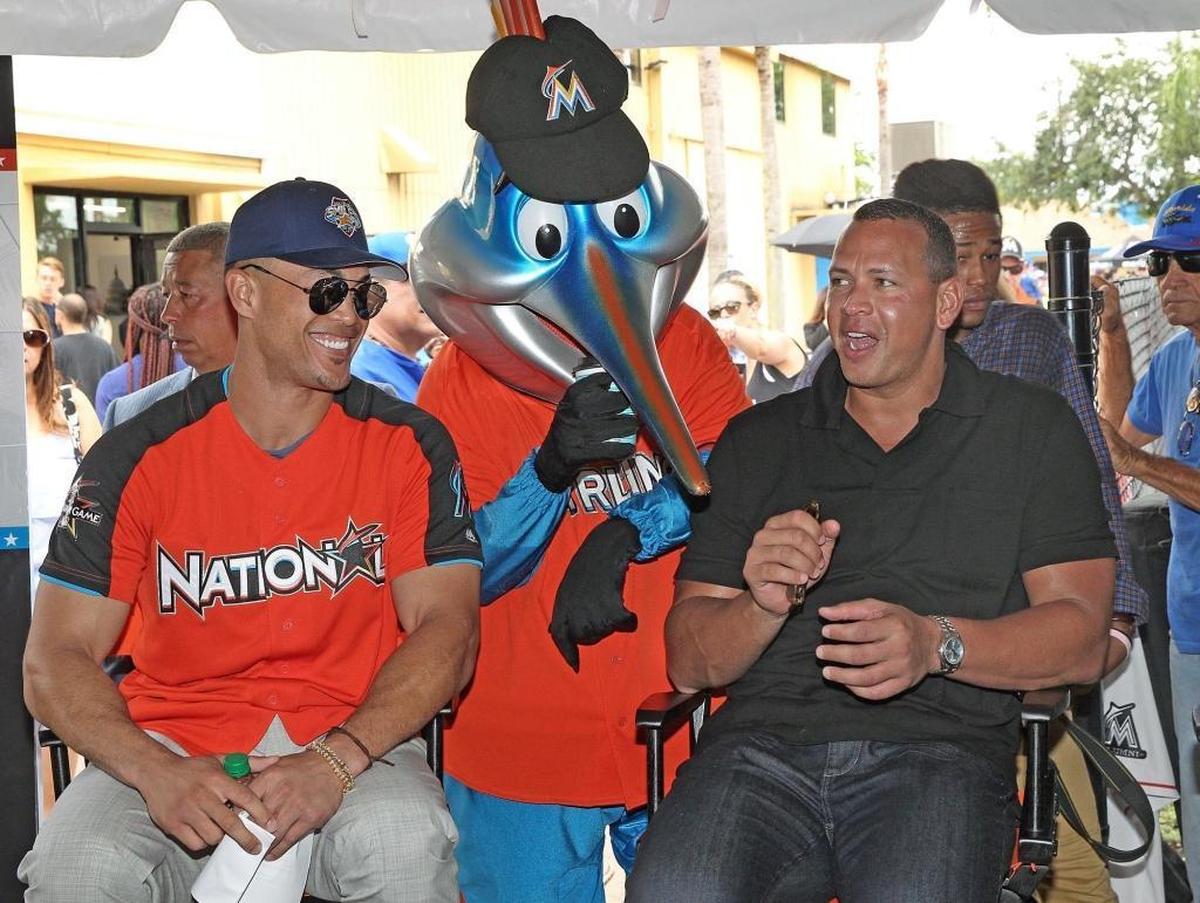 Marlins Giancarlo Stanton chats with former Yankees All-Star Alex Rodriguez at the new teen center at Kendall Club of Boys & Girls Club of Miami-Dade on Tuesday morning.