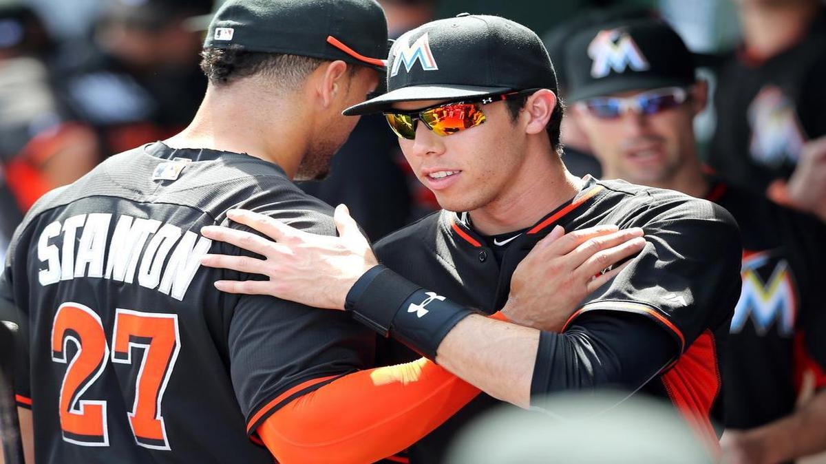 
“Hopefully, we’re still playing meaningful games” when Giancarlo Stanton returns, Marlins teammate Christian Yelich, right, said of the ailing slugger. 
