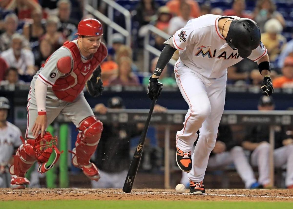 Miami Marlins shortstop JT Riddle (39) avoids stepping on the ball at the foul line as the Miami Marlins play the Philadelphia Phillies at Marlins Park on Wed., July 19, 2017.