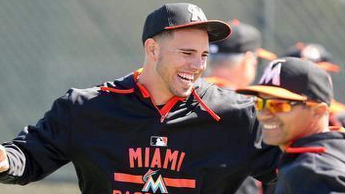 
Miami Marlins pitcher Jose Fernandez, center, jokes with teammates as pitchers and catchers report for spring training Friday, Feb. 20, 2015 at Roger Dean Stadium in Jupiter, Florida.
