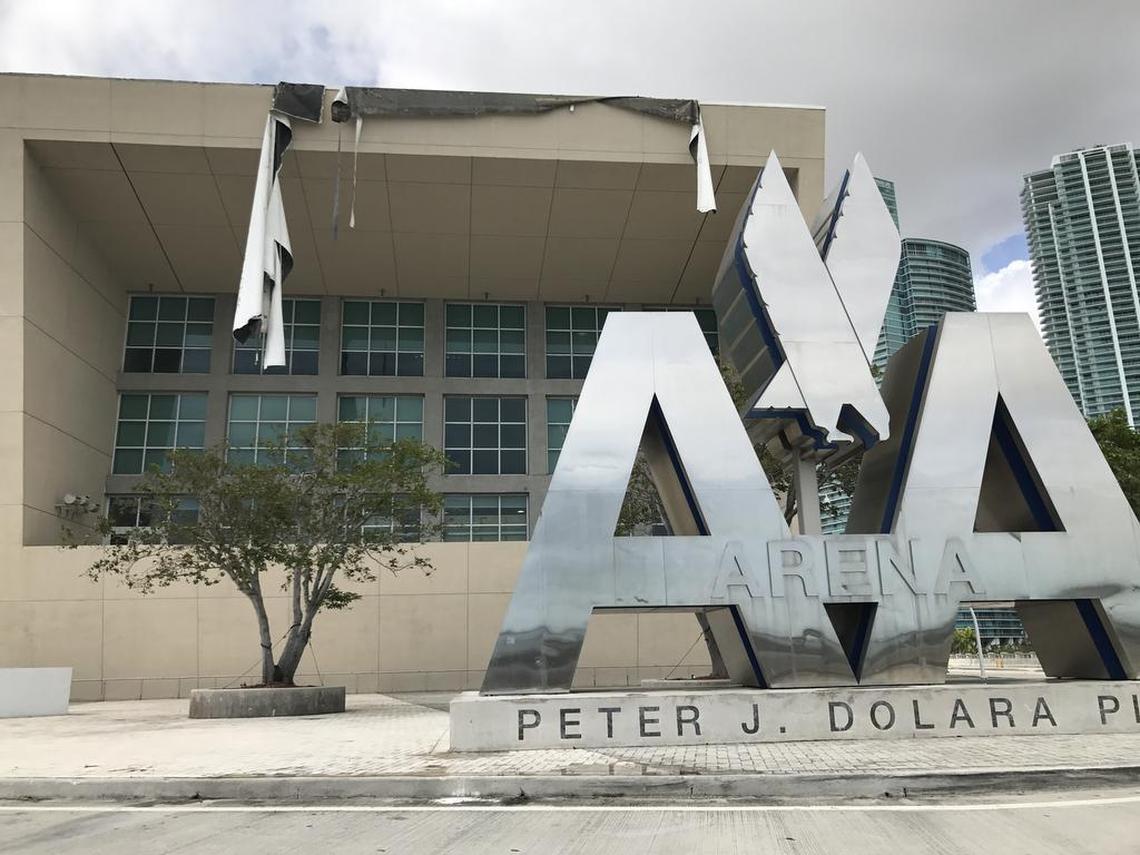 Pieces of tarp hang from the roof of the Miami Heat practice facility at AmericanAirlines Arena following Hurricane Irma on Monday, Sept. 11, 2017.